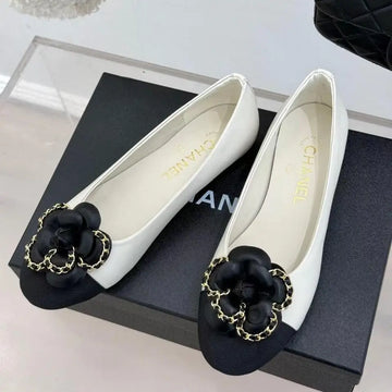 Chanel Ballet Flats – White Leather with Black Cap Toe & Gold Chain Flower