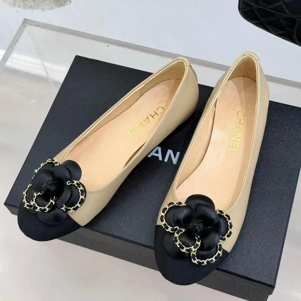 Chanel Ballet Flats – White Leather with Black Cap Toe & Gold Chain Flower